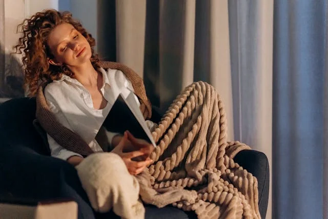 Home Sensory Oasis - Women in chair with blanket