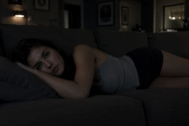 Headaches and Migraines with Fibromyalgia  - Woman lying in the dark room